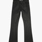 Close-up of the black waxed denim jeans with stacked design 