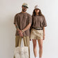 Styled on a model, PURE Monclair Brown Tee demonstrating versatile oversized urban style