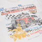 Cropped white tee with racing graphic, 2 inches shorter than standard fit