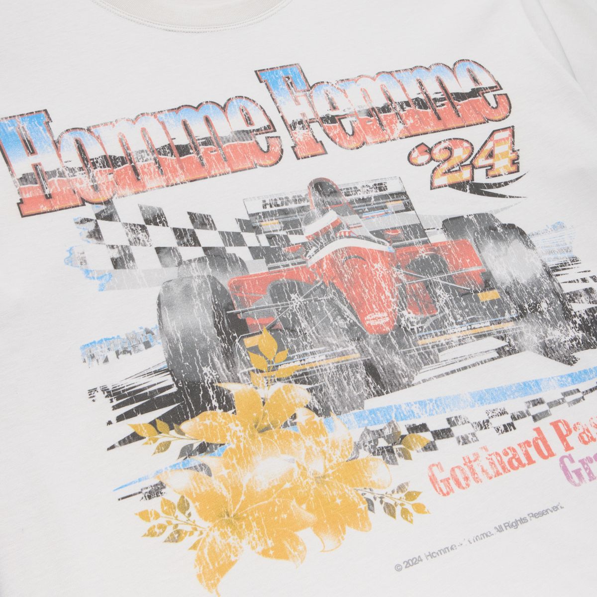 Cropped white tee with racing graphic, 2 inches shorter than standard fit