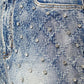 Model with tall stature wearing size 32 aqua blue embellished denim shorts demonstrating their modern cut and sparkling details