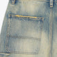 Detailed shot of the waistband and button closure of Valabasas Mr Straight vintage wash denim jeans