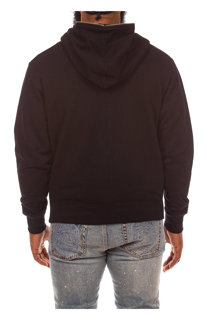 Close-up of the black BBC BB Curve zip-up hoodie displaying the stylistic design and zipper detail