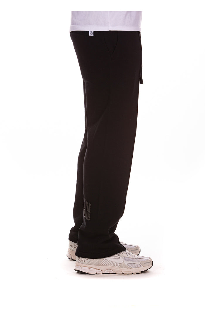 Side perspective of the Billionaire Boy's Club Black BB Curve Sweatpants highlighting the relaxed fit and style number 851-6112