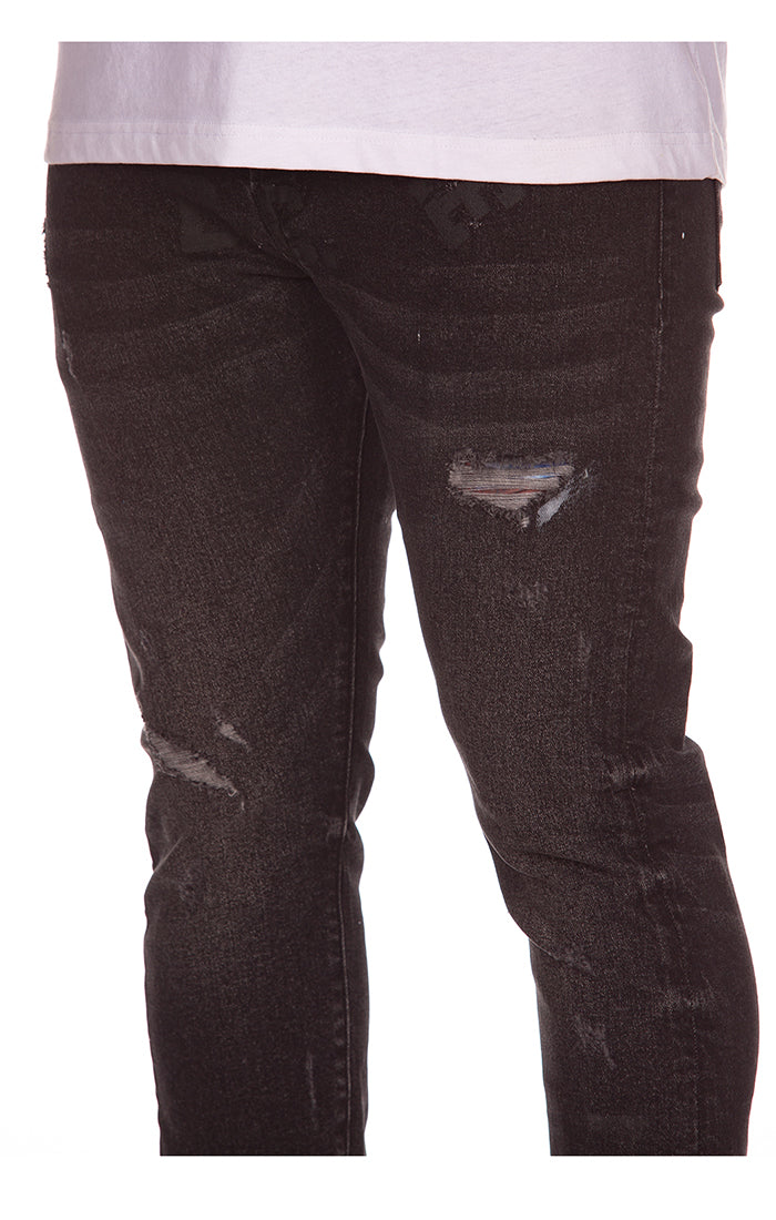 Side view of the BBC Midnight BB Trek Jeans, emphasizing the slim fit and modern silhouette