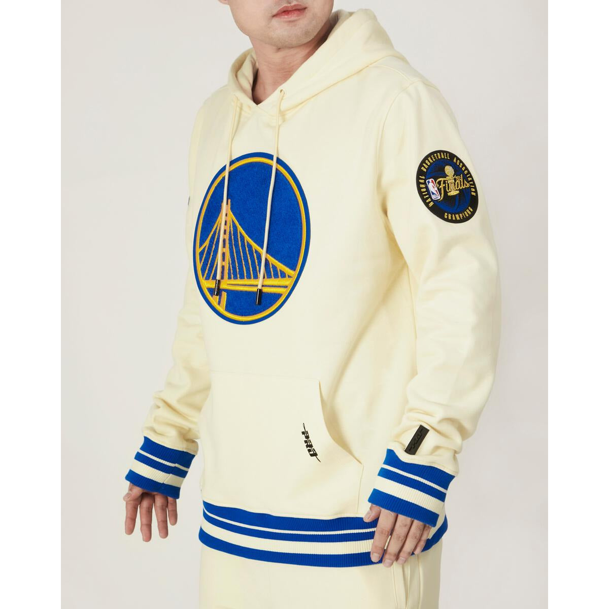 Pro Standard Golden State Warriors Retro Classic Hoodie in Eggshell and Royal Blue with team logo and retro design on front 