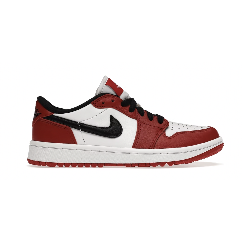 Red and white Jordan 1 Retro Low -Golf Chicago shoes on grass