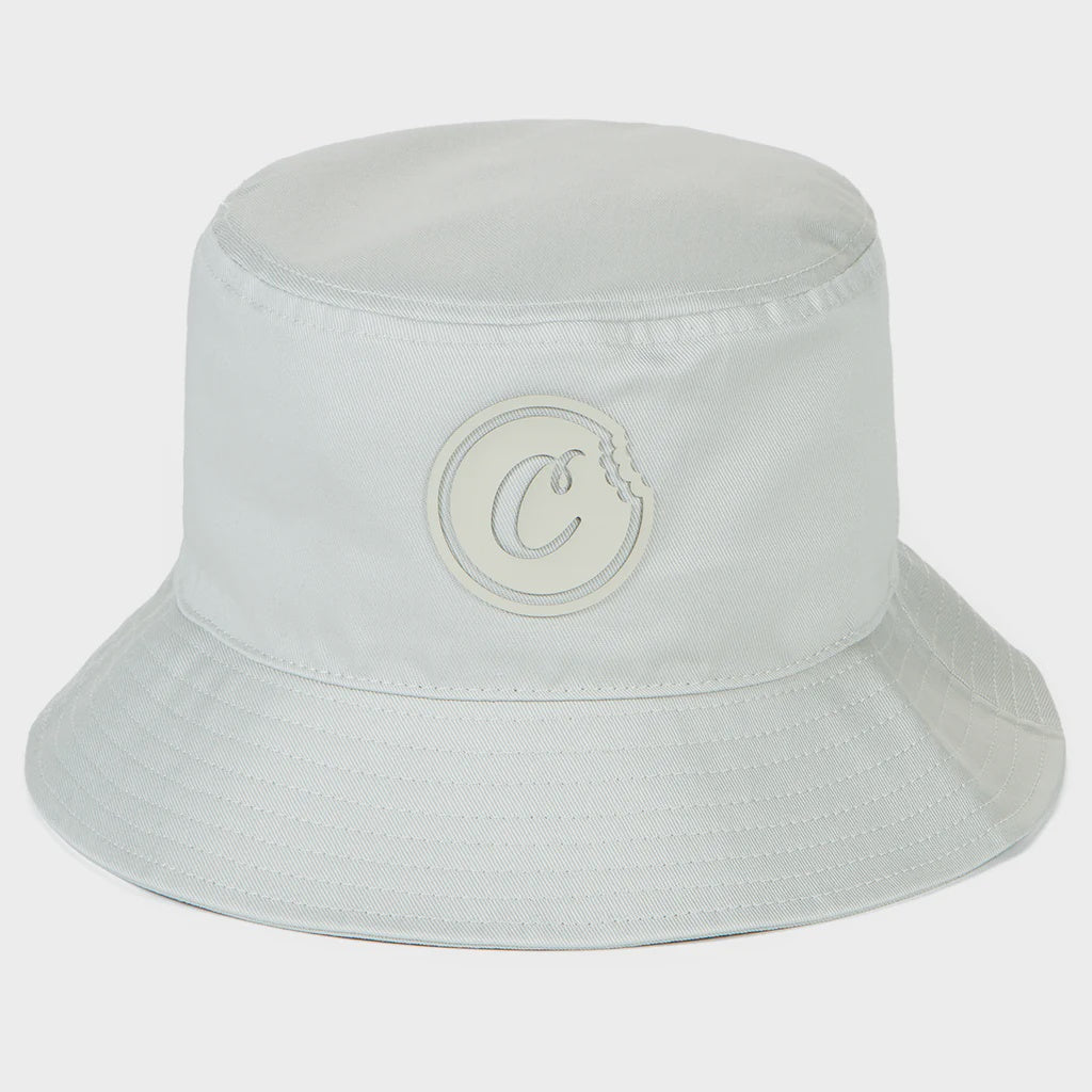 Alt text: Cookies First Light Sand Bucket Hat, a stylish and versatile accessory for sunny days at the beach or casual outings, featuring a wide brim and breathable fabric in a light sand color