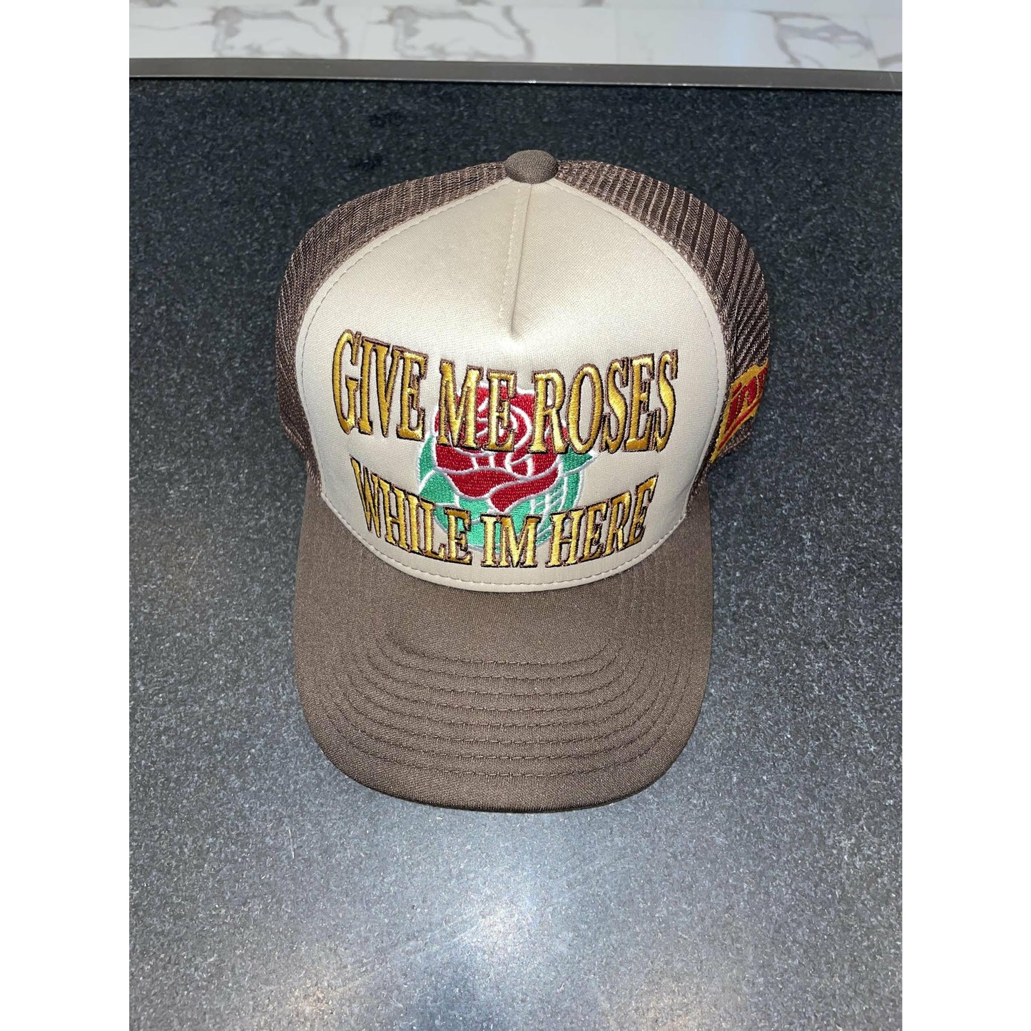 Give Me Roses While Im Here Trucker Hat - Brown