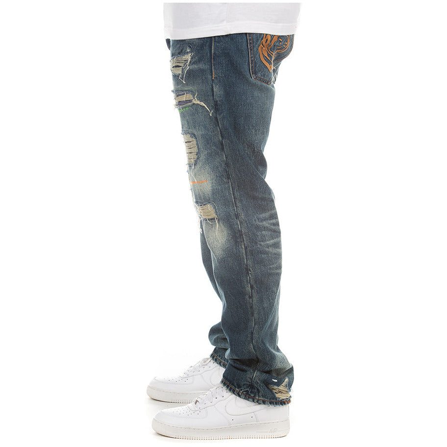  Side view of BBC Fortuna BB Blaze Jeans (821-8101) showing the logo patch and signature stitching details on the back pockets